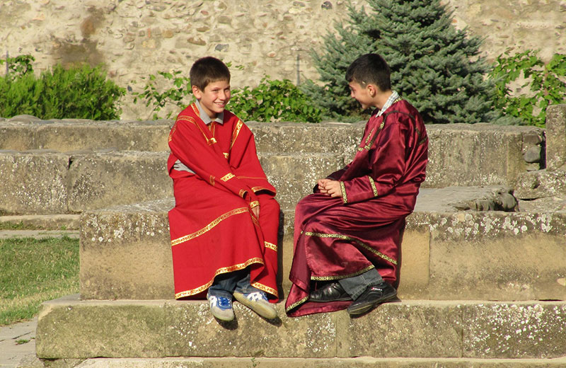 Two Georgian boys talking to each other